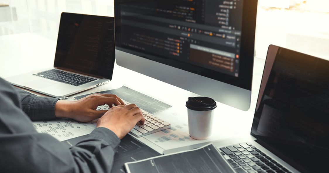 developer building custom website on multiple screens